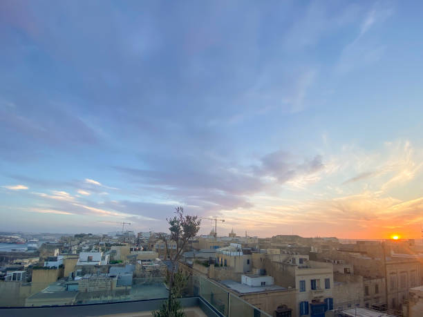 istock Sunset skyline with old buildings from a rooftop in Valletta, Malta 2168155347