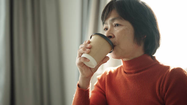 istock Mature woman enjoy hot drink. 2168161561
