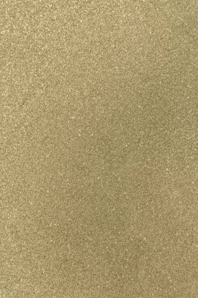 istock gold shiny glitter texture place for text 2168162574