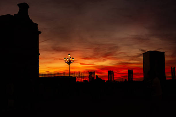 Sunset in Armería Scuare between Almudena Cathedral and Royal Palace in Madrid