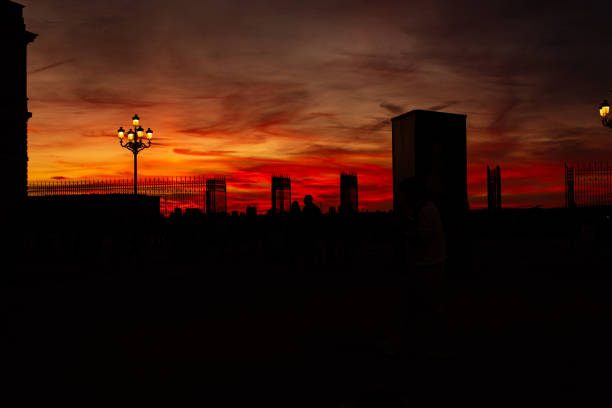 Sunset in Armería Scuare between Almudena Cathedral and Royal Palace in Madrid