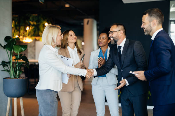 istock Professionals shaking hands at a meeting 2168174591