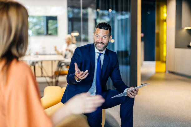 istock Manager in vibrant discussion with colleague 2168174630
