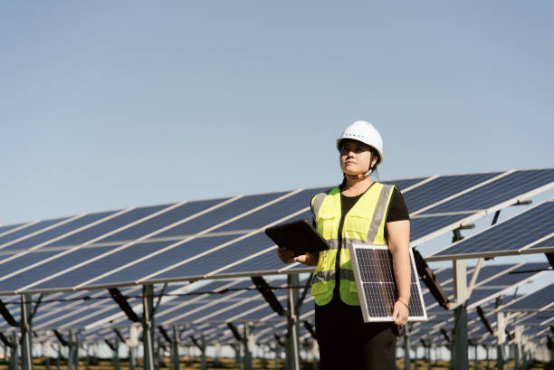istock female technician working with tablet  in solar power station 2168174821