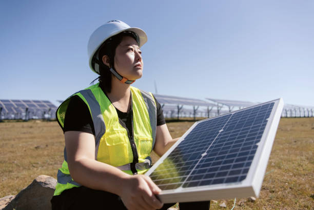 istock female technician working in solar power station 2168175375