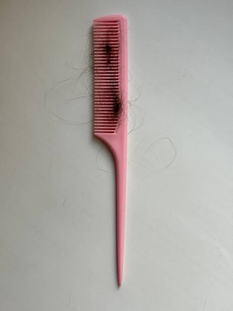 istock clump of hair on comb. comb pulls hair. 2168175909