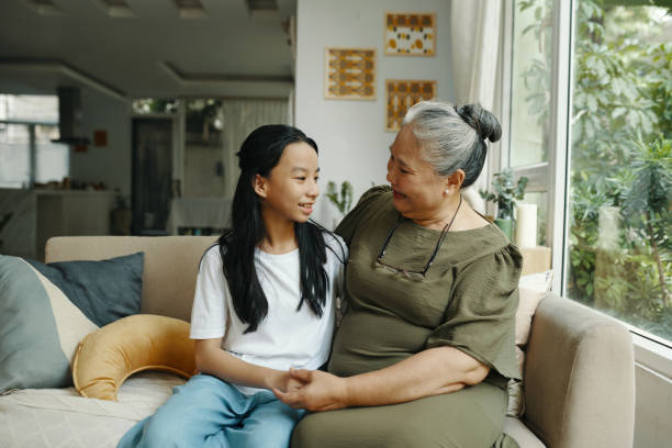 istock Grandmother Communicating With Her Granddaughter 2168176438