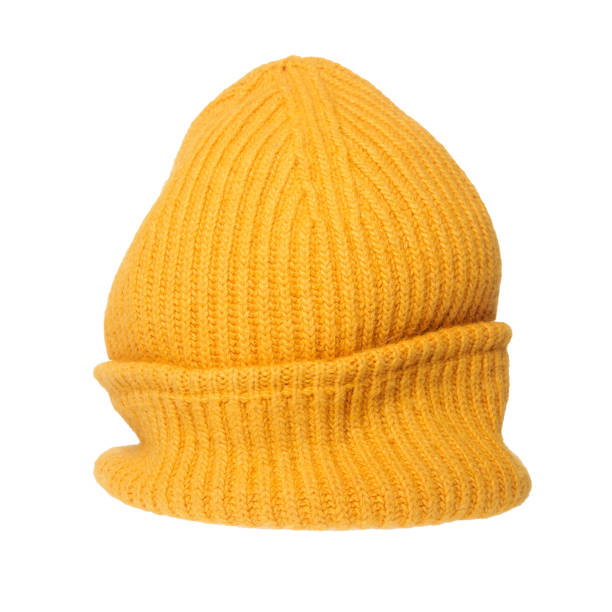 istock Bright orange knitted hat close-up. A warm and stylish accessory with an expressive texture, ideal for the cold 2168180922