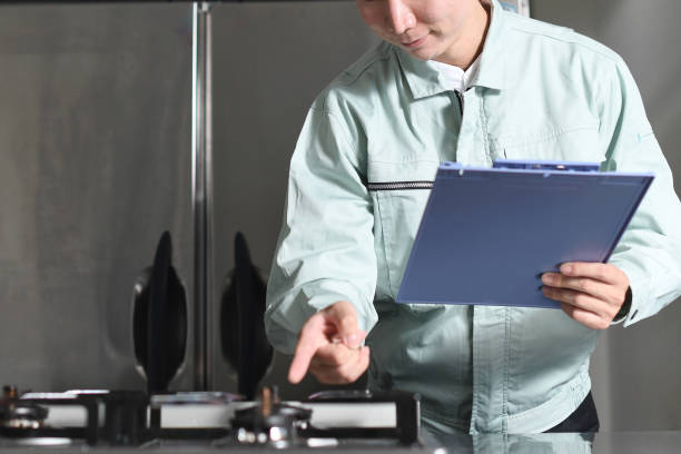 istock A male worker inspecting the stove in the kitchen 2168187259