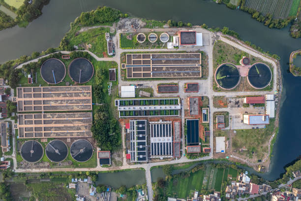 istock Aerial view of sewage treatment plant between fields and rivers 2168190604