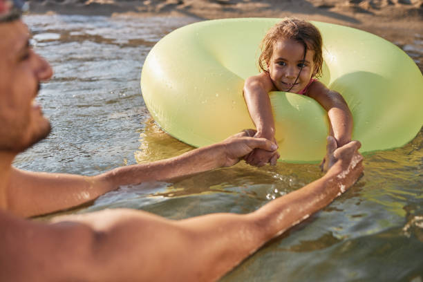 istock Beautiful father and daughter enjoying summer vacation 2168192500