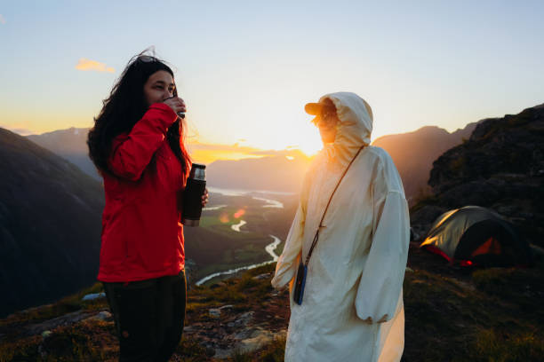 istock Cheerful Hikers Having Coffee Time Camping with Idyllic Mountain Views 2168192610
