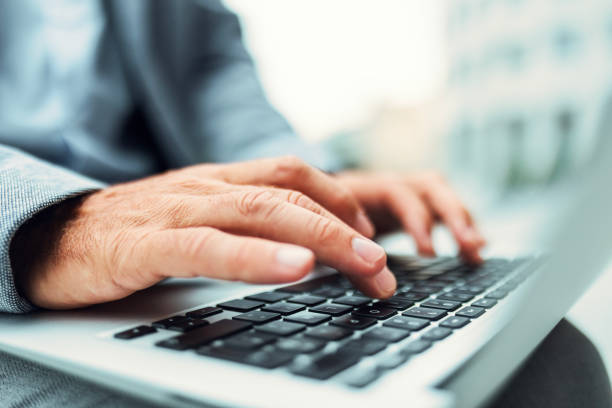 istock Unrecognisable businessman working, scrolling, typing on laptop 2168194901