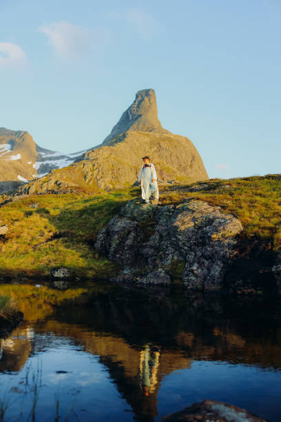 istock Hiker Admiring Sunset Views Over Reflection Lake in the Mountains 2168194960