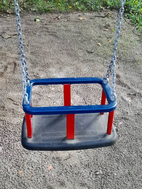 istock Empty baby swing on the playground 2168195143