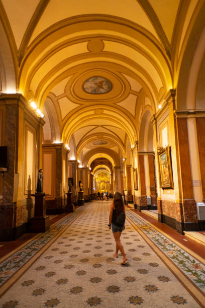 Young woman inside the cathedral in the city of Buenos Aires in Argentina