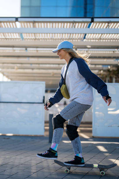 istock Active Urban Female Skater Cruising on Board 2168207563