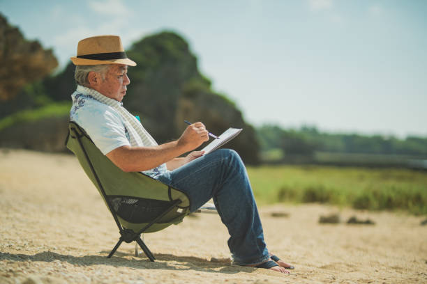 istock Senior men past retirement age relax and enjoy their hobbies on a sandy beach. 2168207651
