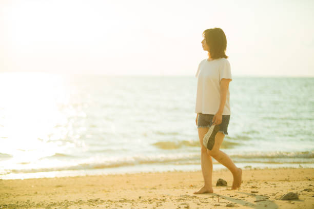 Young generation living in Asia spending time with friends and family at the beach