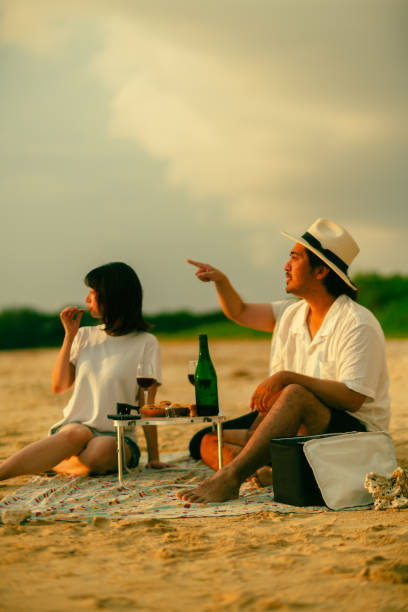 Young generation living in Asia spending time with friends and family at the beach