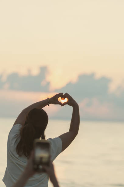 Young generation living in Asia spending time with friends and family at the beach