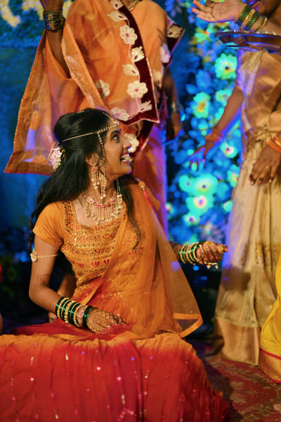 istock Bride joyful moments with relatives during her haldi ceremony 2168210701