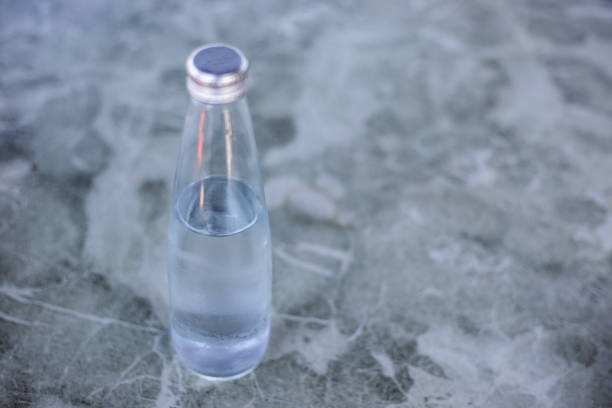 Young Black Woman Reaching For Water Bottle.