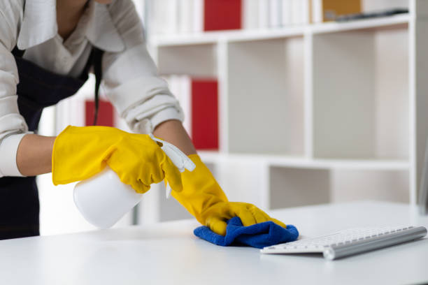 istock Young Asian cleaning woman uses a cloth to wipe clean a computer and keyboard using cleaning solution in her home office. 2168221108