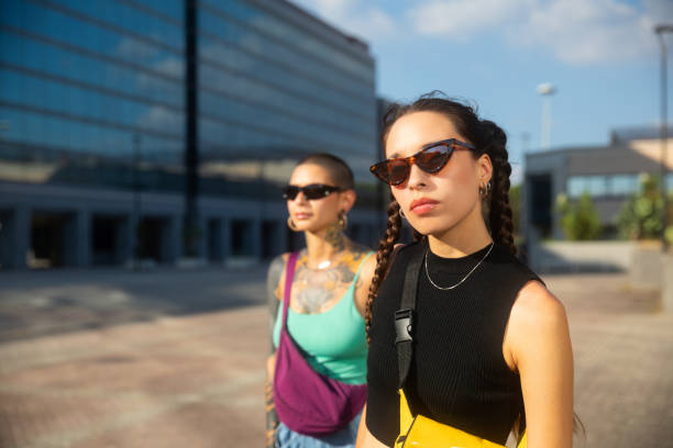 istock Two young women standing looking at camera 2168221406