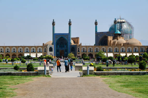 Aerial and ground photographs showing the dry riverbed of the Zayandeh Rud River in Isfahan, Iran. The once-vibrant river has turned into cracked earth due to severe drought and climate change, symbolizing the growing environmental challenges in the region and the impact of water mismanagement. in isfahan khaju bridge
