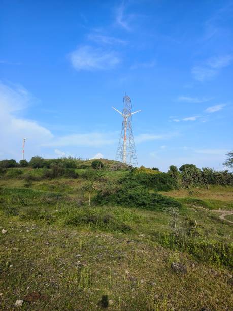istock Landscape with Electric poles and windmill 2168230207