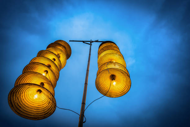 Vietnamese traditional conical hats hanging on wire for decoration.