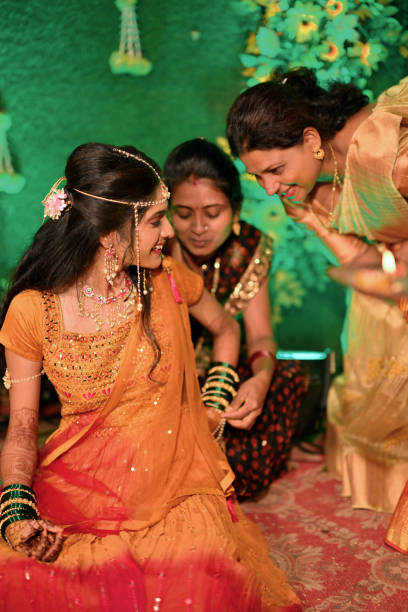 istock Bride joyful moments with relatives during her haldi ceremony 2168233643