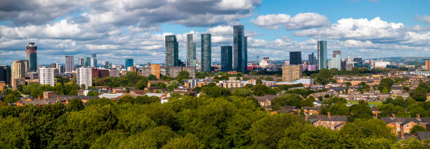 istock Manchester skyline with white clouds and blue sky 2168245296