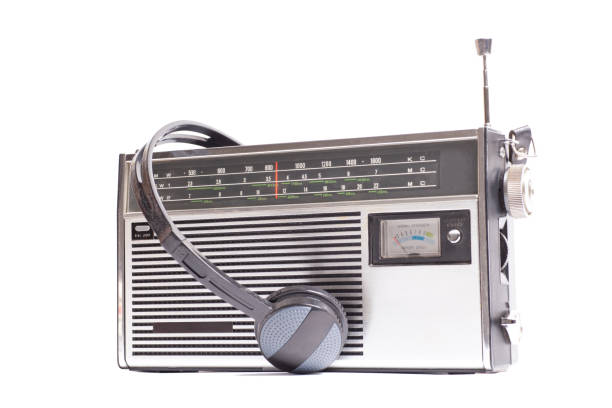 Vintage transistor radio with headphones.