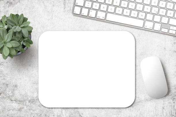 minimalist mousepad mockup with blank pad keyboard, mouse and a succulent plant on a white wooden desk