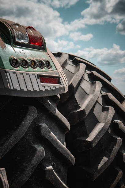 istock Dual-Wheel Tractor Preparing Field for Planting 2168249537