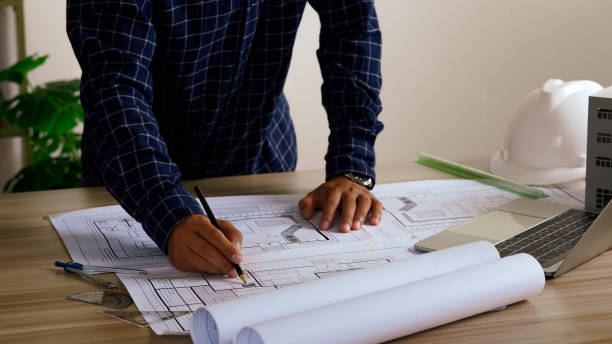 istock Engineer Drawing Architecture Plan And Construction Design. Design and build a new residential building - Real estate concept. 2168252422