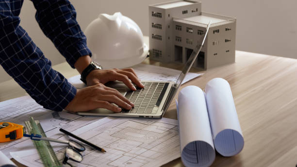 istock Engineer Drawing Architecture Plan And Construction Design. Design and build a new residential building - Real estate concept. 2168252433