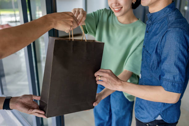istock The couple's package moment at home 2168252516