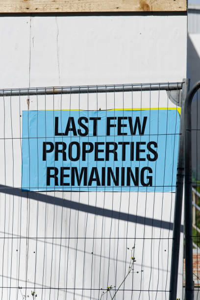 istock Last few properties remain for sale sign at new housing development 2168257721