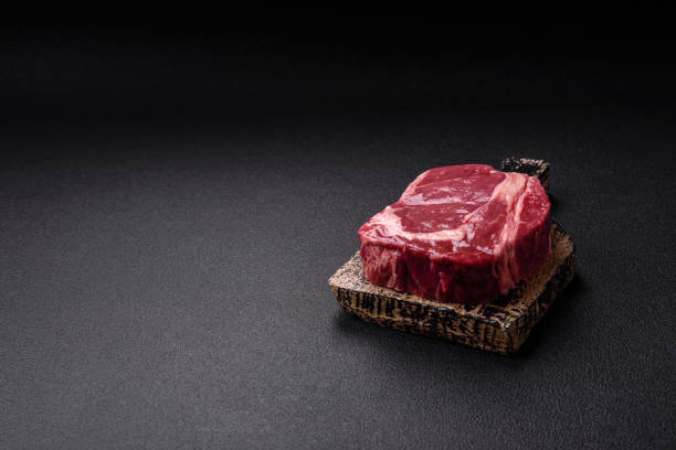 istock Fresh, raw beef steak with salt, spices and herbs 2168258710