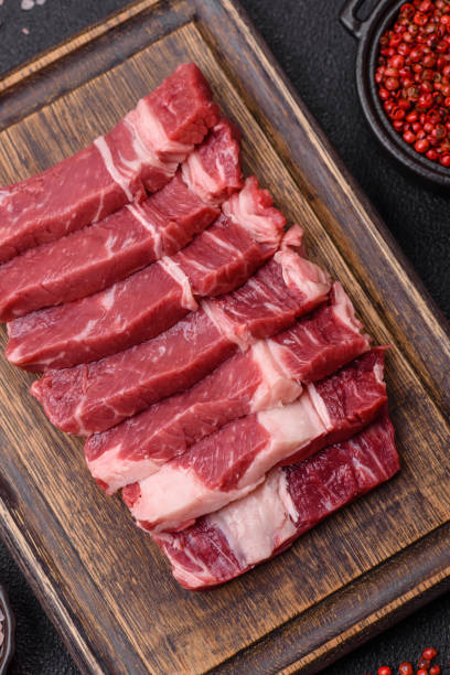 istock Fresh raw beef cut into slices with salt, spices 2168259275
