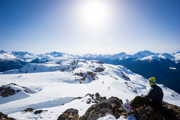 istock Skier pauses on mountain top 2168265846