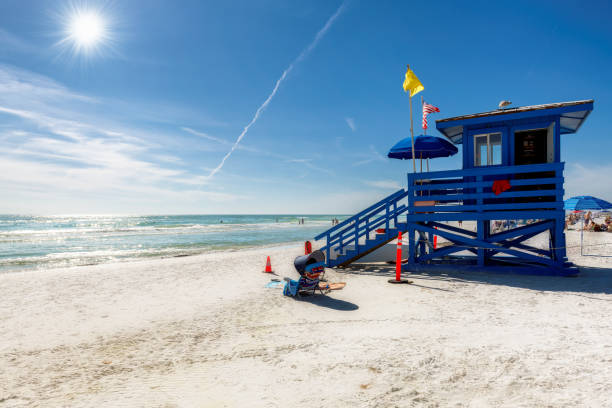 Lifeguard hut on Sunny Siesta Key Beach in a beautiful summer day with ocean and blue sky, Florida