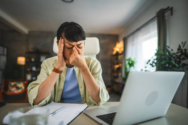 istock mature japanese woman have eyestrain while work from home 2168269819