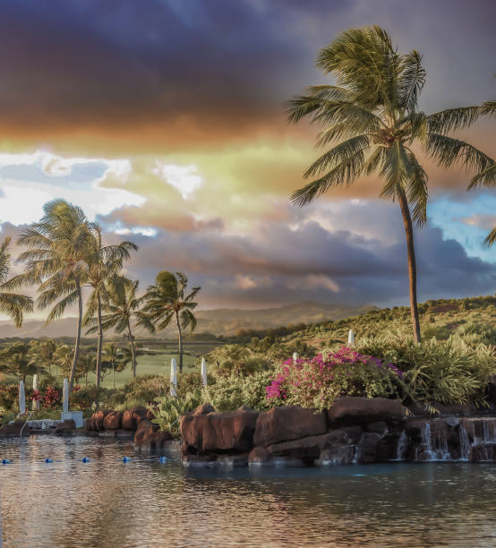 istock Multi colored sky during an intense sunset as storm clouds move across the landscape of this beautiful tropical Hawaiian island of Kauai 2168271058