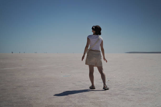 istock Beautiful young Asian female tourist using her virtual reality VR glasses, while exploring the Salt Lake in Konya Turkey, Turkiye. 2168273683