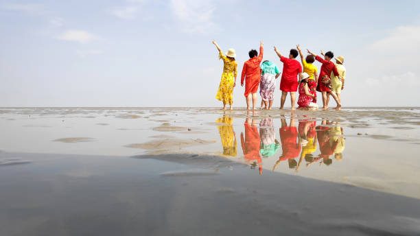 Kuala Selangor, Malaysia- 7 Mar 2019: Visitors at Sasaran beach in Selangor, Malaysia. It also known as Sky Mirror which is popular local attraction in Selangor.