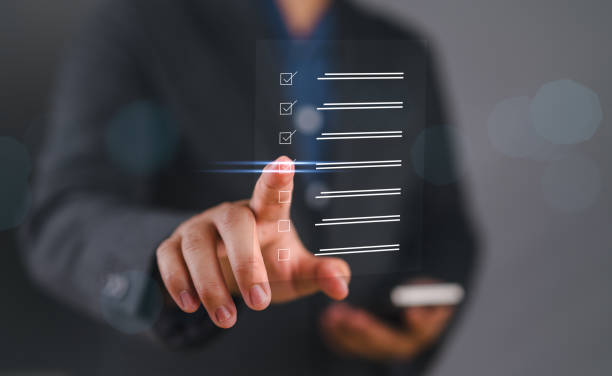 istock Business performance checklist, businessman using smartphone doing online checklist survey, filling out digital form checklist, take an assessment, questionnaire, evaluation, survey, online exam. 2168300003